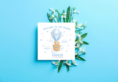 Personalised New Baby Boy Card Congratulations for Newborn Son, Grandson, Nephew, Welcome To The World Card - Teddy Bear with Hot Air Balloon Design with Custom Name and Date - Blue Envelope Included