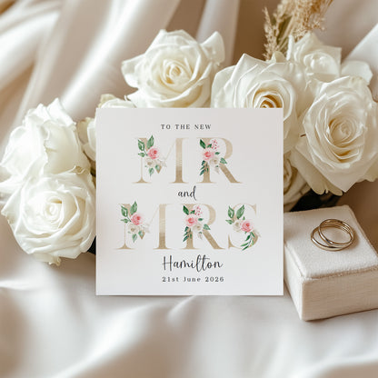 Personalised Mr & Mrs Wedding Card – Custom Surname & Wedding Date – Gold Effect Floral Letters Design - Wedding Congratulations Card for Newlywed couples, Him or Her - Kraft Envelope Included
