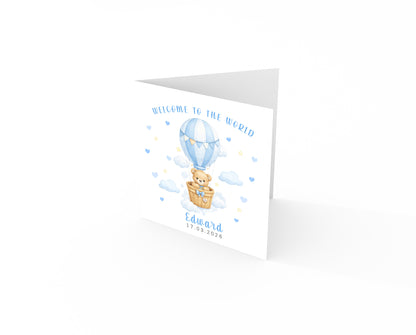 Personalised New Baby Boy Card Congratulations for Newborn Son, Grandson, Nephew, Welcome To The World Card - Teddy Bear with Hot Air Balloon Design with Custom Name and Date - Blue Envelope Included