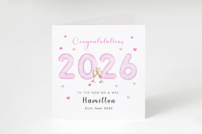 Personalised 2026 Wedding Card - Custom Couple's Surname & Wedding Date – Pink 2026 with Champagne Toast Design - Wedding Congratulations Card for Newlywed couples, Him or Her - Pink Envelope Included