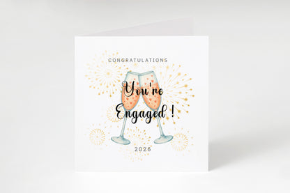 2026 Engagement Card - You’re Engaged Champagne Toast Design - Elegant Fireworks Congratulations Card for Newly Engaged Couple, Him or Her - Kraft Envelope Included