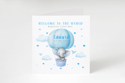 Personalised New Baby Boy Card Congratulations for Newborn Son, Grandson, Nephew, Welcome To The World Card - Elephant in a Hot Air Balloon Design with Custom Name and Date - Blue Envelope Included