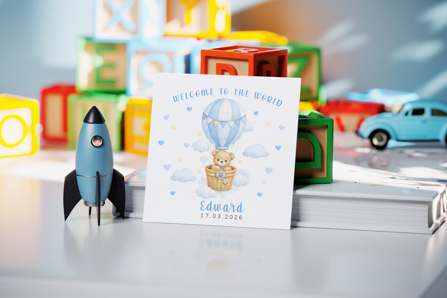 Personalised New Baby Boy Card Congratulations for Newborn Son, Grandson, Nephew, Welcome To The World Card - Teddy Bear with Hot Air Balloon Design with Custom Name and Date - Blue Envelope Included