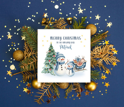 Personalised Christmas Card for Dad 2025 – Custom Name Xmas Card for an Amazing Dad – Cute Snowman & Tree Design – Festive Holiday Greeting Card with Blue Envelope – Gift from Son or Daughter
